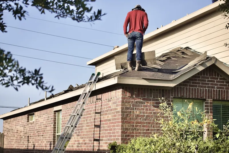 Professional roofer working on a residential roof in Calabasas Park Estates